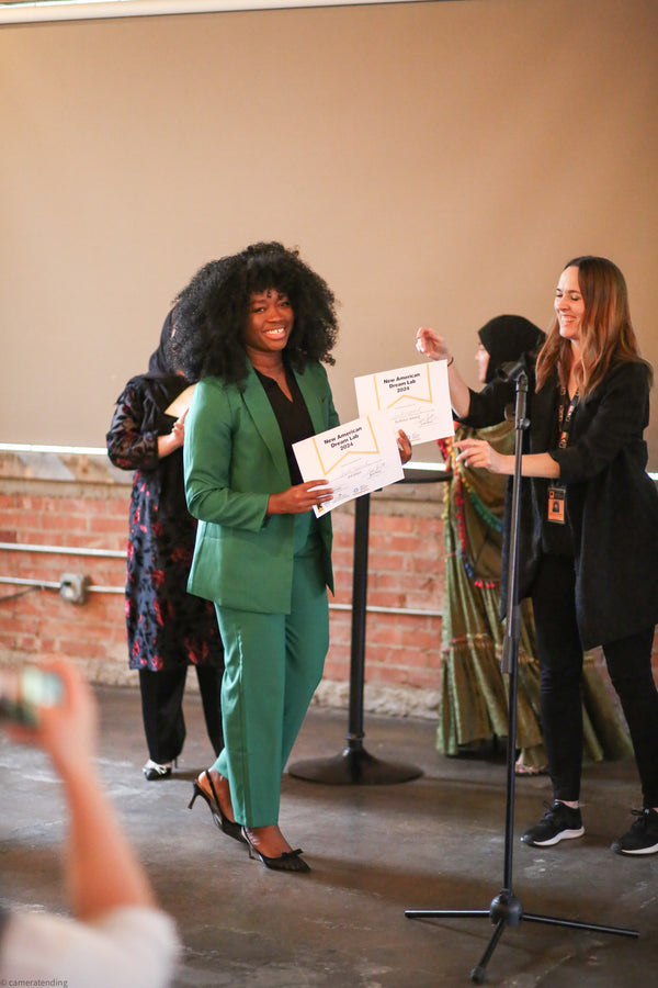 Princess Bombyck accepting awards at The New American Dream Lab pitch competition